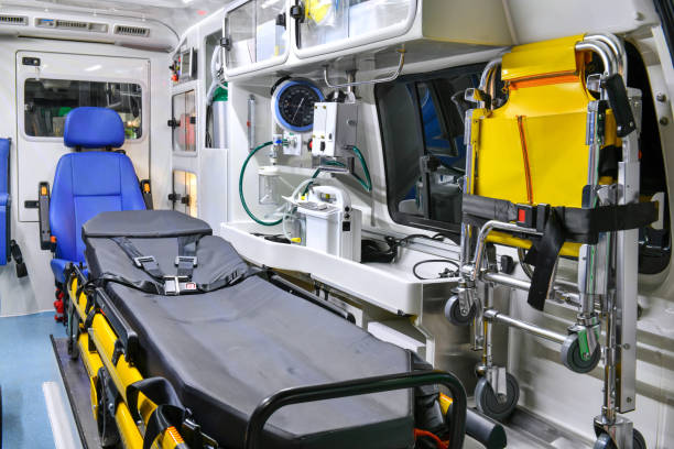 Emergency equipment and devices, Ambulance interior details. opened white and orange travel trailer